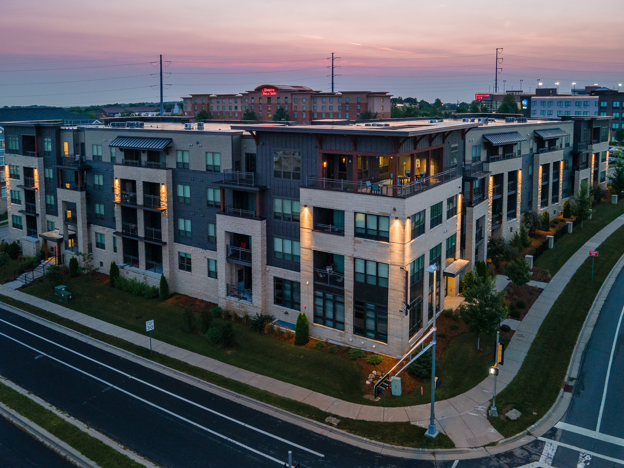 Aerial view of an apartment complex at dusk