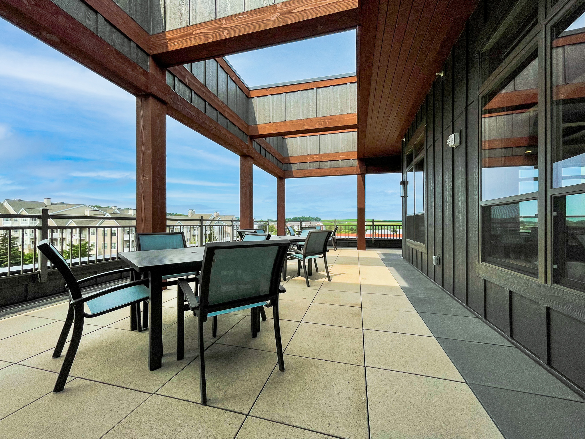 Large balcony with tables and chairs